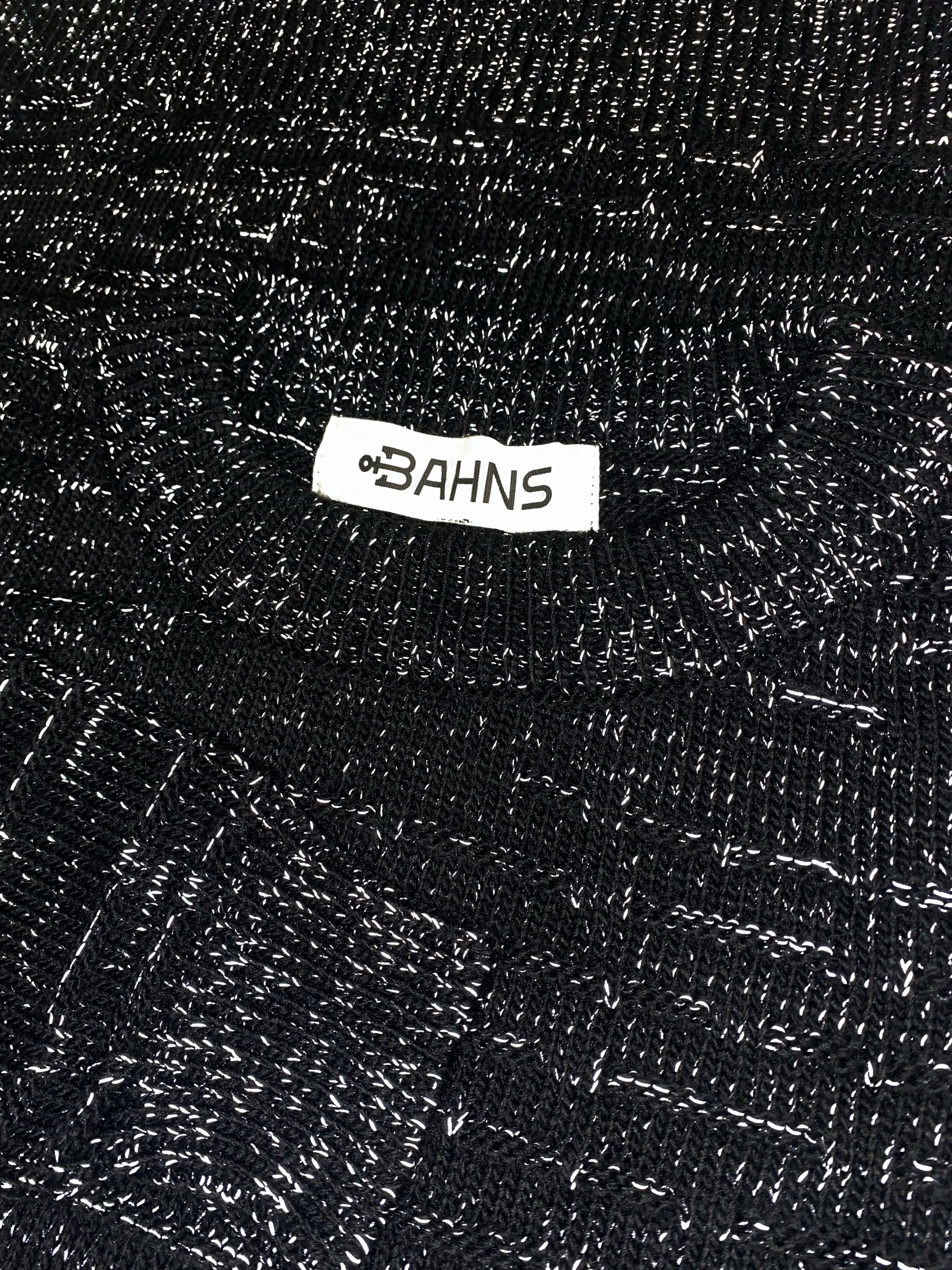 James Cook - Cropped, reflective yarn